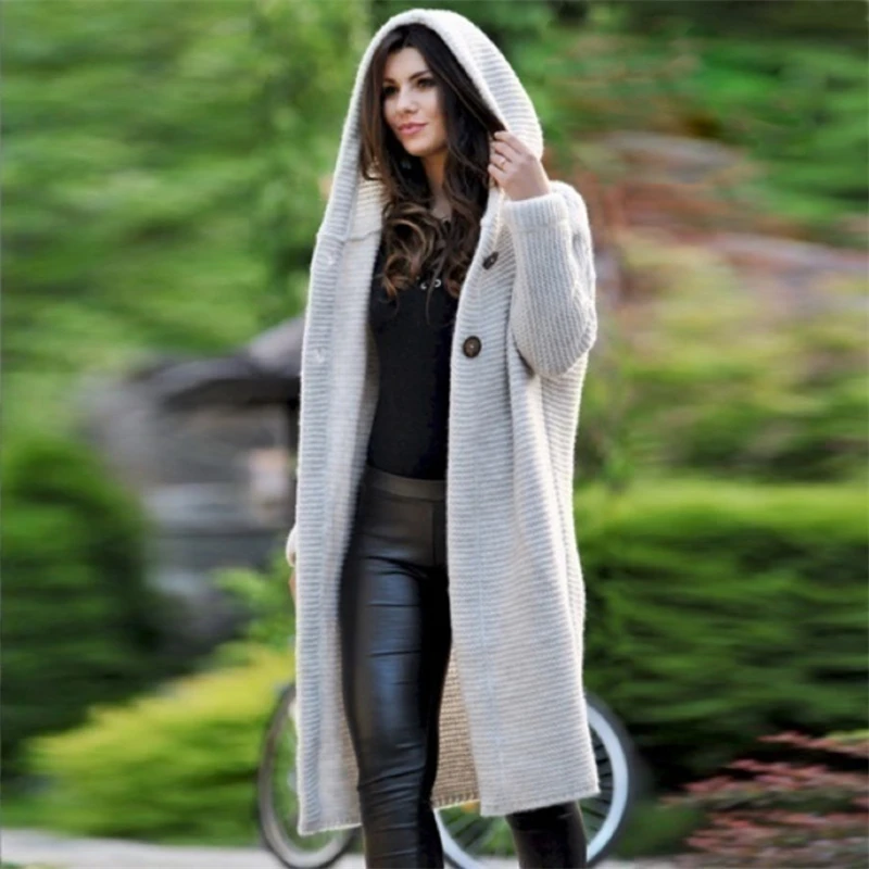 Woman wearing oversized cashmere cardigan with slim jeans demonstrating perfect proportion balance