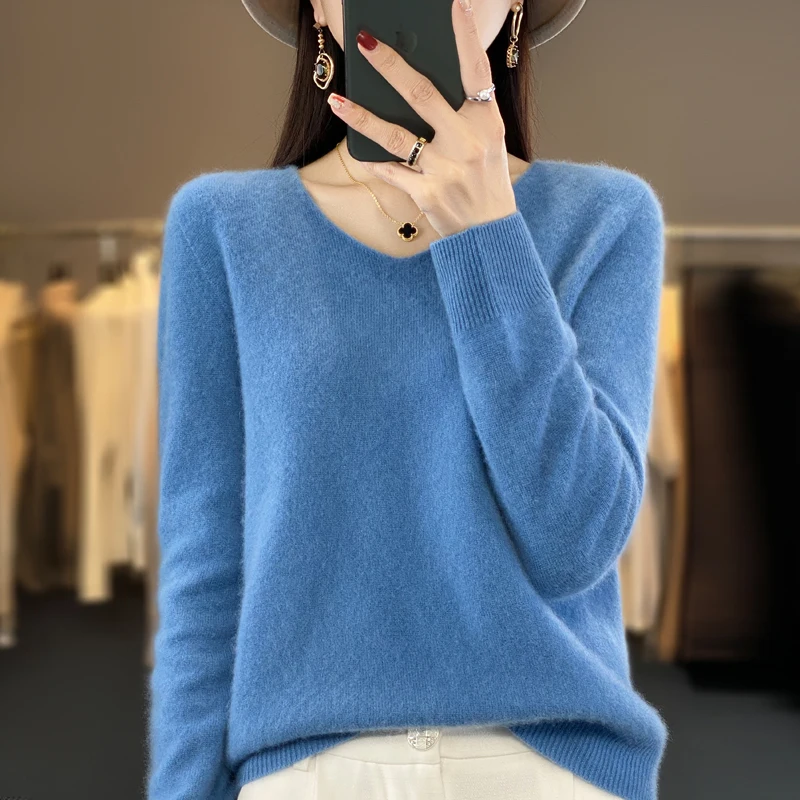 Women's elegant cashmere sweater styled with jeans for a refined casual outfit