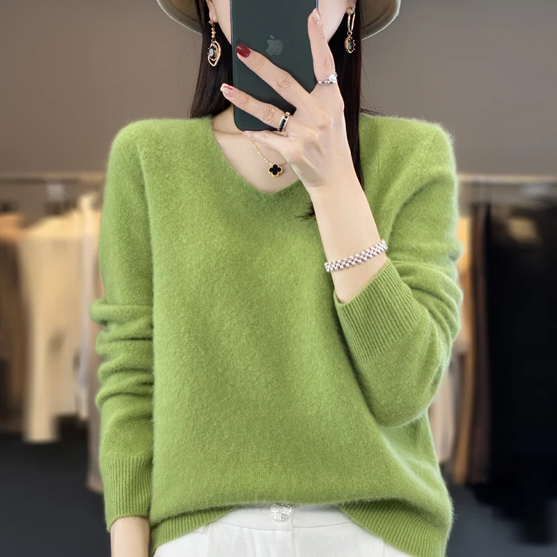 Elegant V-neck cashmere sweater paired with relaxed jeans for effortless style